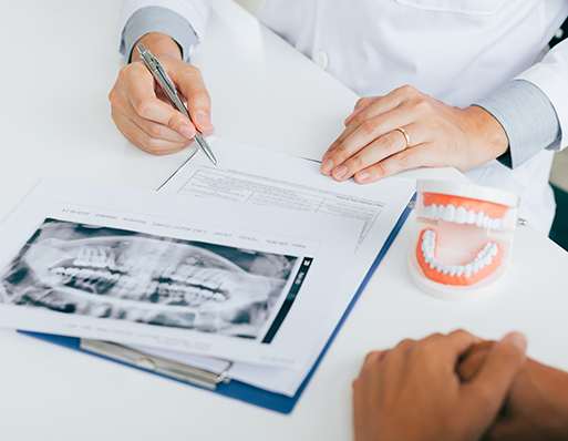 Barrie dentist explaining the Canadian Dental Care Plan (CDCP) to a patient